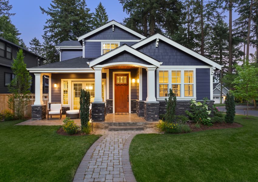 large-home-with-triangle-roof-pillars-and-grass