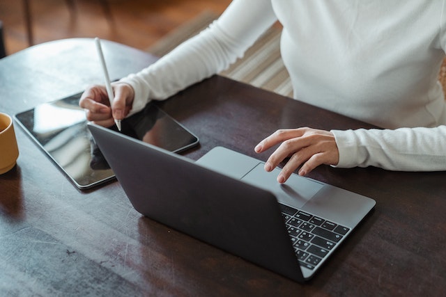 property-manager-sitting-at-desk-with-laptop