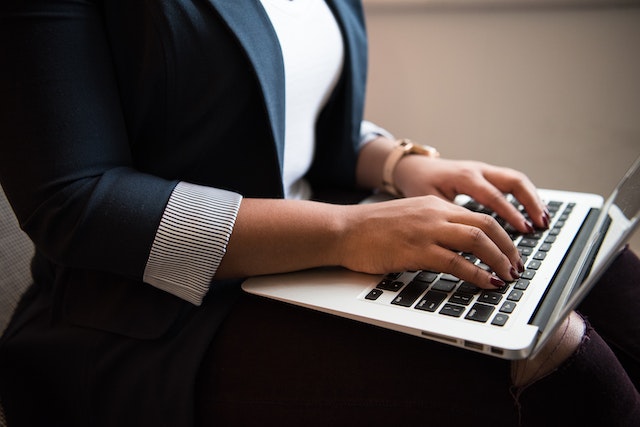 property-manager-sitting-down-typing-on-laptop-2